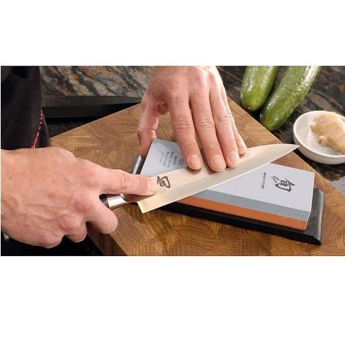 Sharpening a Shun knife on a whetstone 